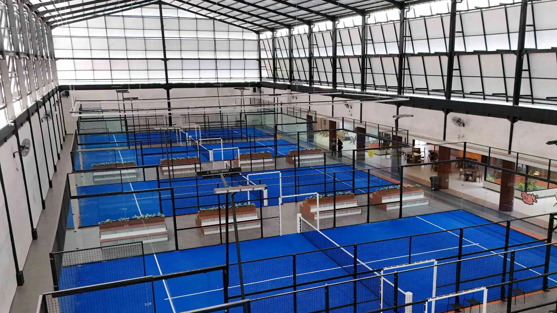Rich Padel Sentul's indoor courts and the lounge alongside them, seen from above