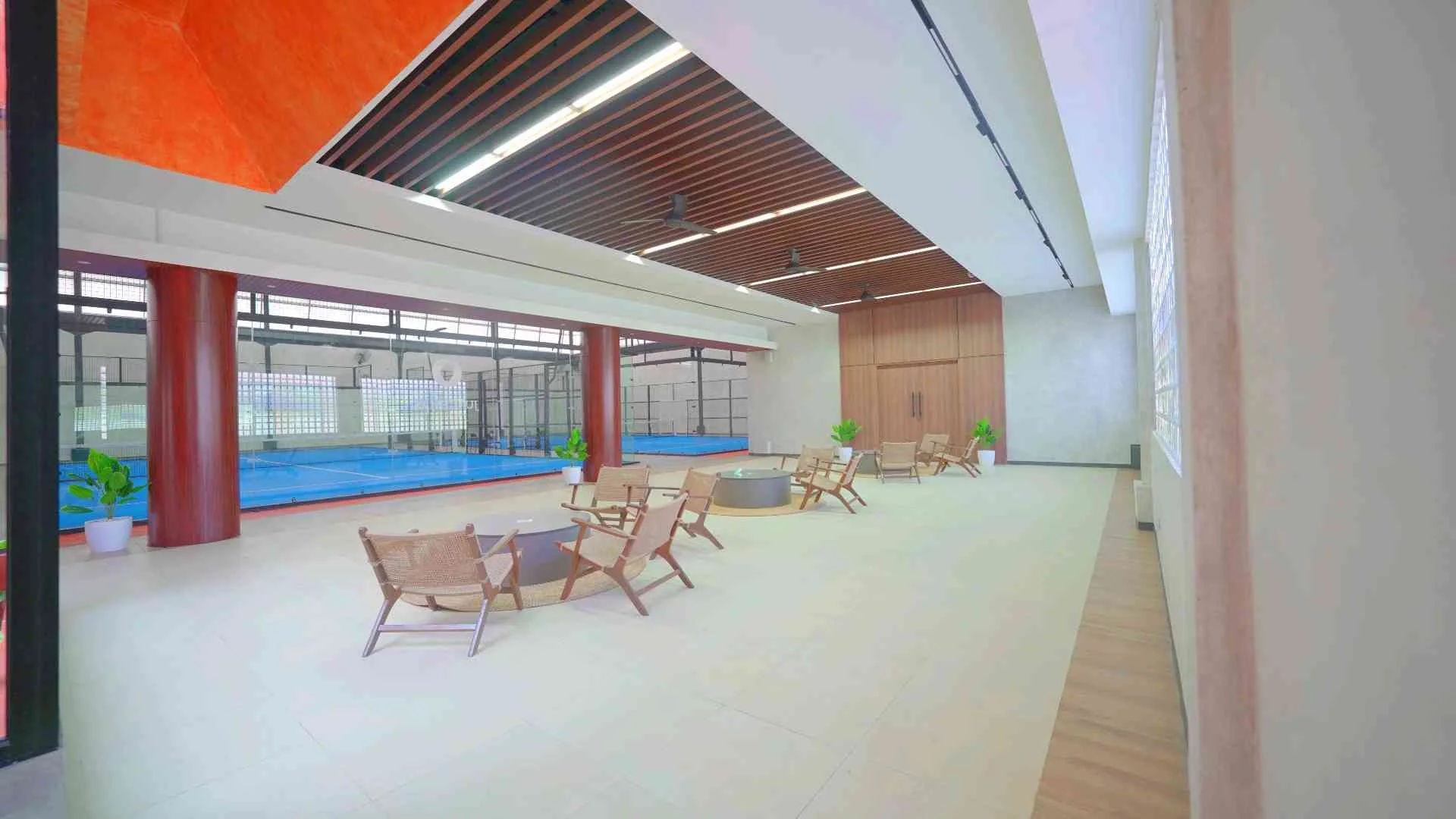 Lounge armchairs beside the indoor courts